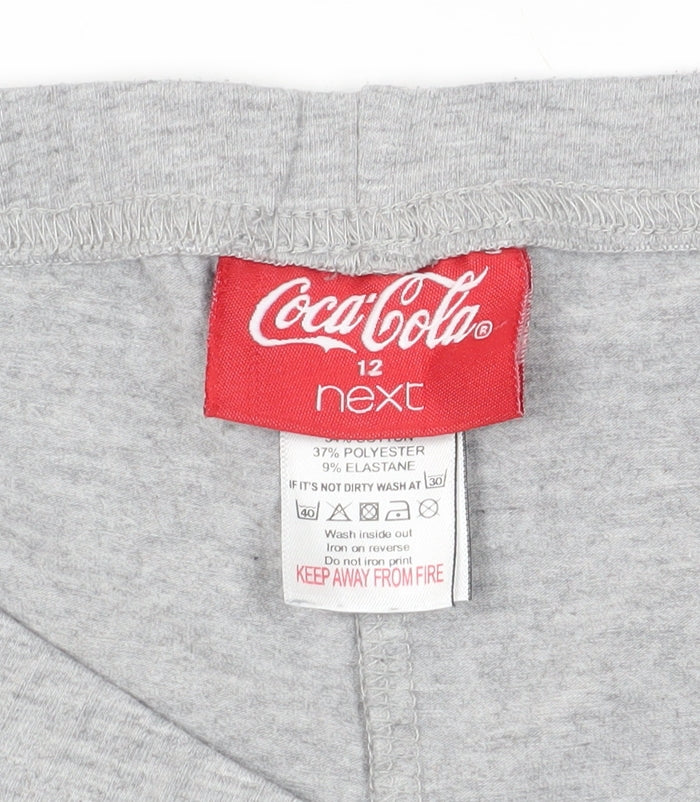 Brand and care label for Next Coca-Cola Grey Logo Shorts, size 12