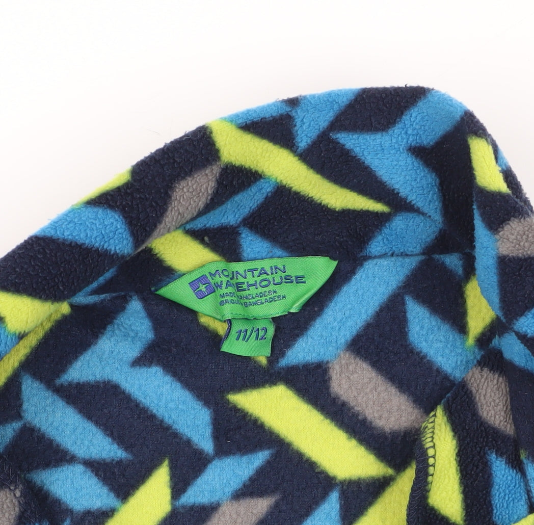 Brand and care label for Mountain Warehouse girls’ multicoloured fleece pullover 11-12 years