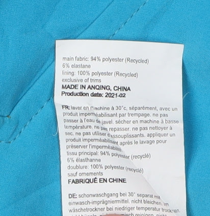 Brand and care label for Mountain Warehouse boys’ blue waterproof hoodie jacket 13 years