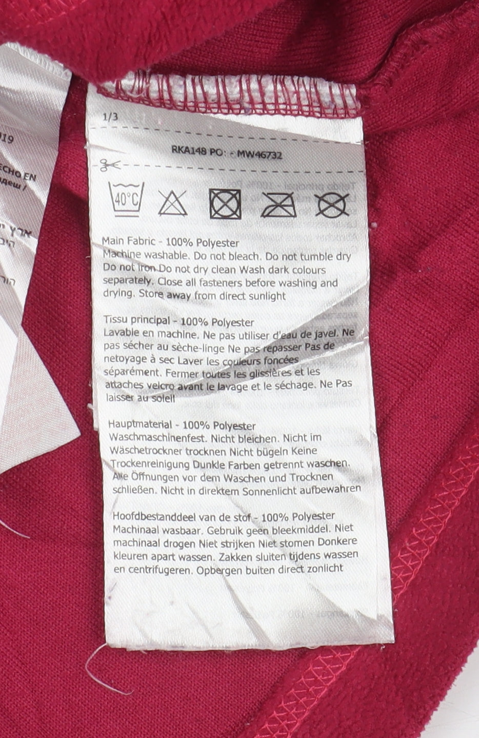 Brand and care label for Regatta girls’ red fleece 1/4 zip sweatshirt 11-12 yrs