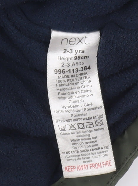Close-up detail of Next boys’ green hooded parka jacket 2-3 years