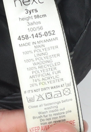 Close-up detail of Next boys’ black puffer jacket 3 years hooded winter