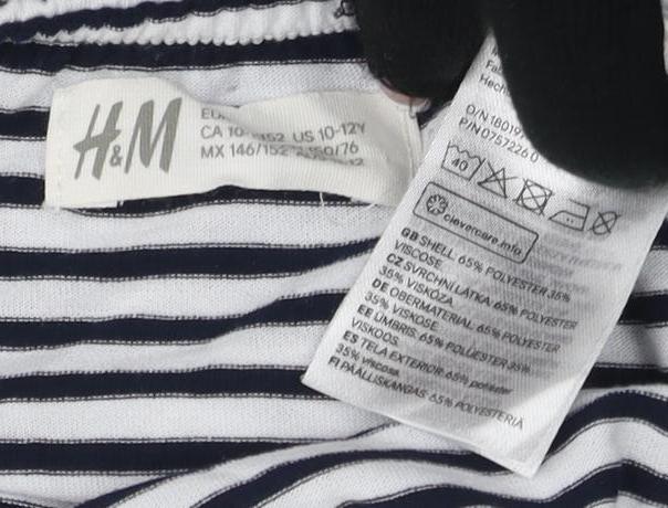 Close-up detail of H&M girls’ off the shoulder blouse, black & white striped, 11-12 years
