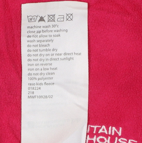 Brand and care label for Mountain Warehouse girls’ pink fleece jacket 11-12 years