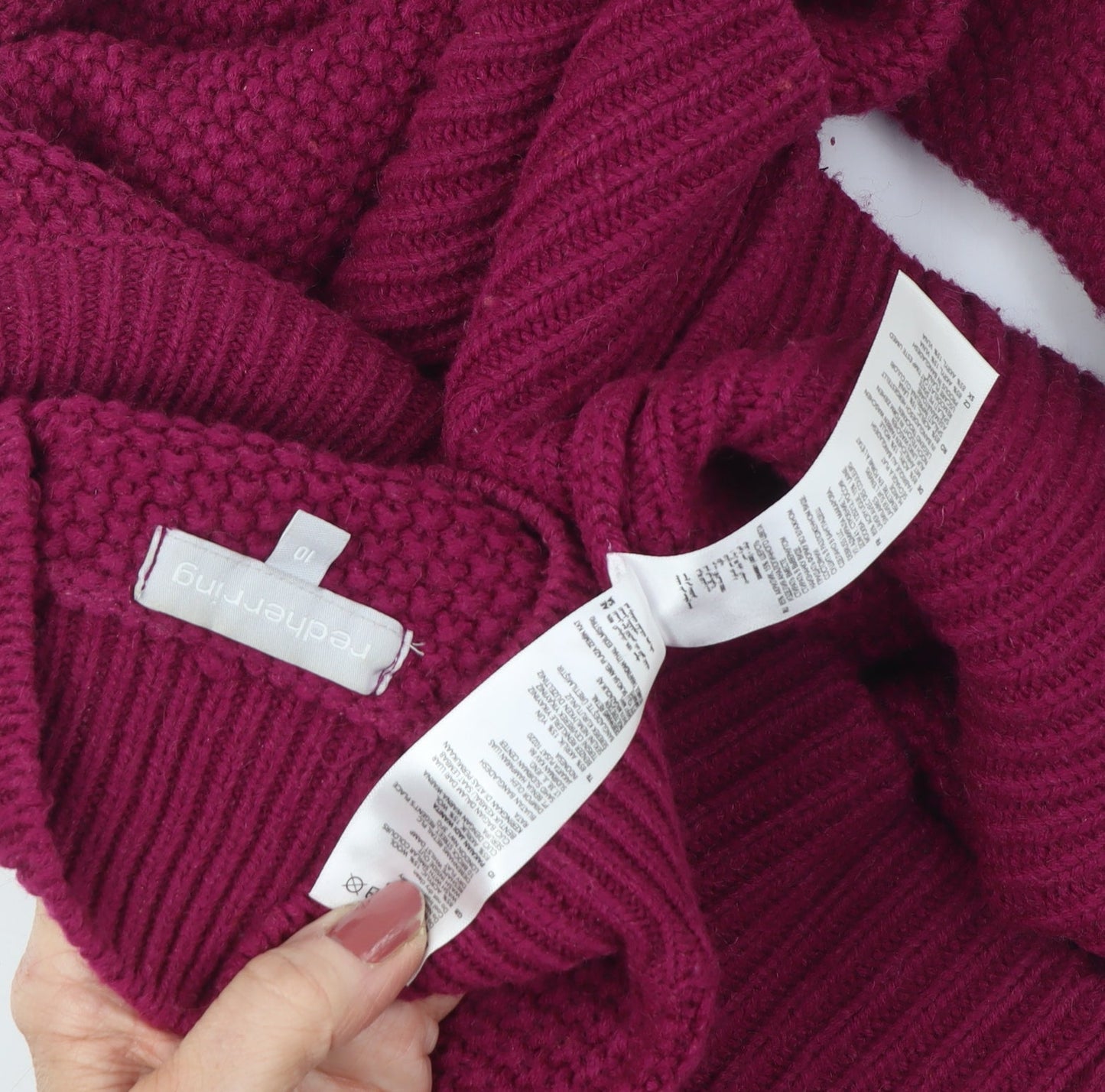 Close-up detail of Red Herring Women's Red Mock Neck jumper, size 10