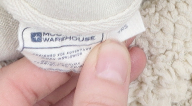 Brand and care label for Mountain Warehouse girls’ beige fleece hoodie prs