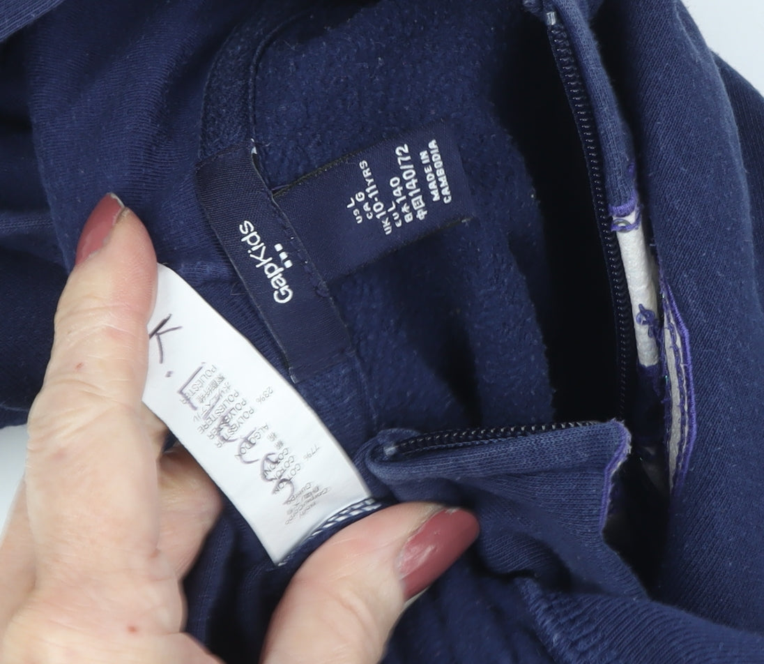 Close-up detail of Gap girls’ blue hoodie, size 10, full zip, casual logo