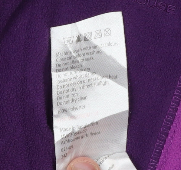 Brand and care label for Mountain Warehouse girls’ purple fleece 1/2 zip sweatshirt 7-8