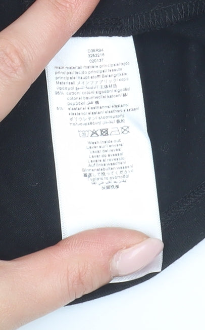 Brand and care label for DKNY girls’ black xs graphic print t-shirt logo