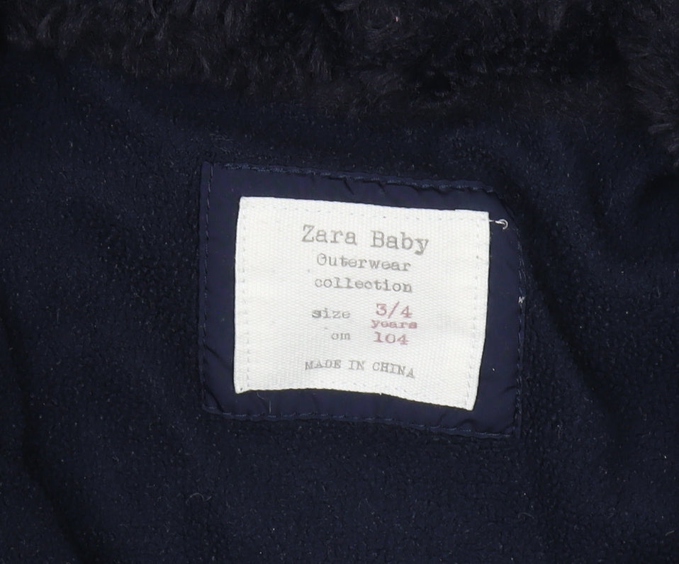 Brand and care label for Zara girls’ blue puffer jacket 3-4 years with hood