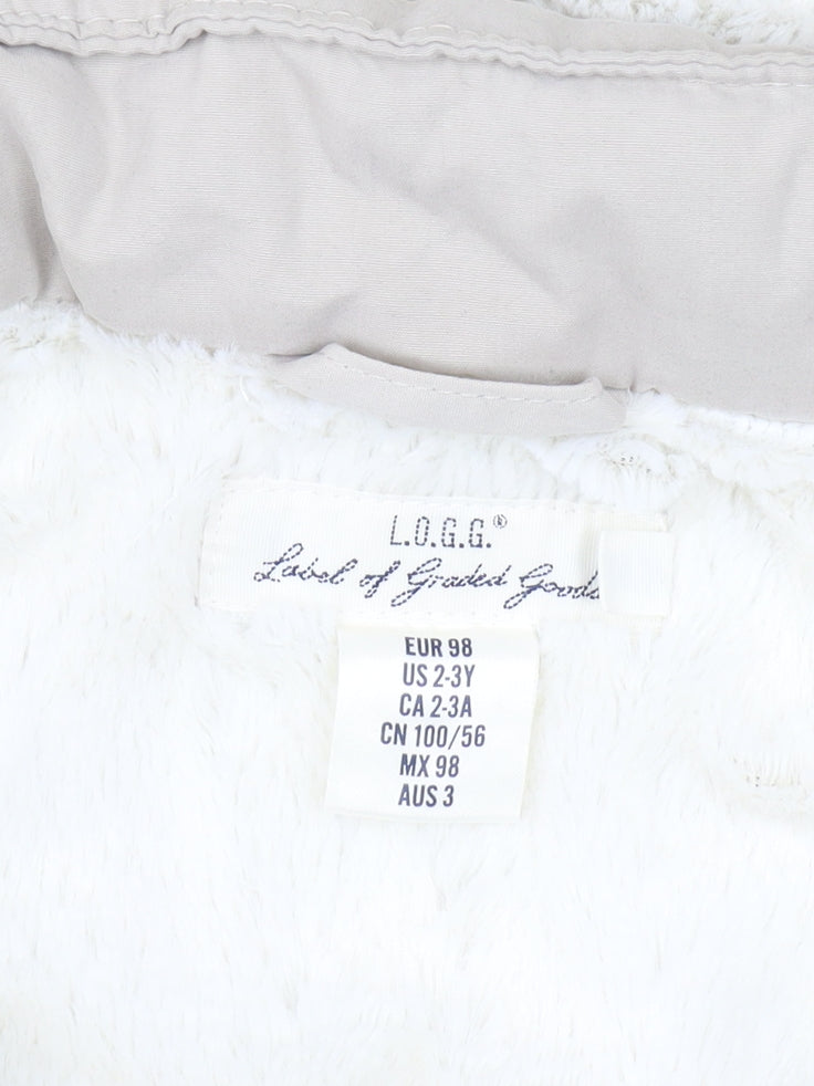Brand and care label for L.O.G.G. girls’ beige parka 3-4 years with faux fur hood