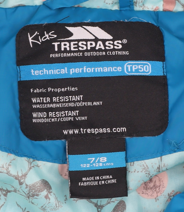 Brand and care label for Trespass girls’ blue puffer jacket, 8 years, winter coat