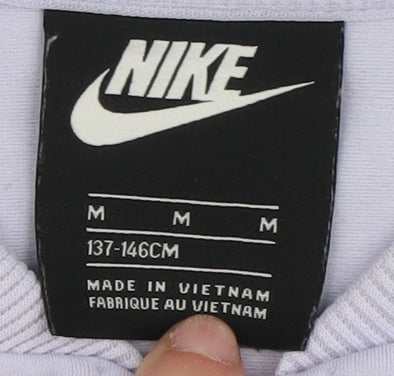 Brand and care label for Nike girls’ purple track jacket, size 146