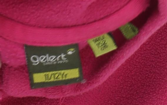 Brand and care label for Gelert girls’ pink fleece jacket 11-12 years