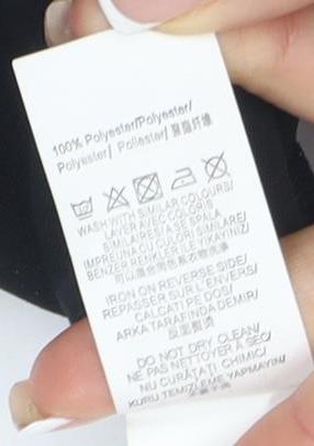 Brand and care label for Missguided Stylish Women's Black Polyster Playsuit, size 8