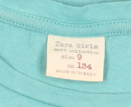 Close-up detail of Zara girls’ green t-shirt, 9 years, crew neck, short sleeve