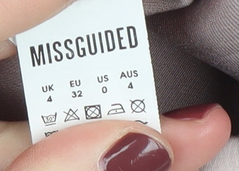 Brand and care label for Missguided Women's Beige Pencil Skirt, size 4