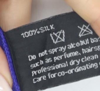 Brand and care label for August Silk Women's Purple Sleeveless V-Neck Tank