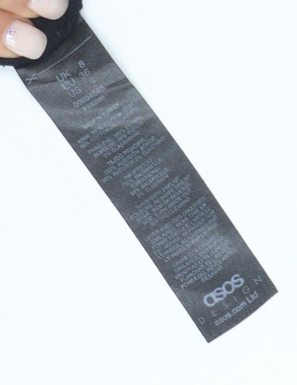 Brand and care label for ASOS DESIGN Black Long Sleeve Cotton Tee, size 8