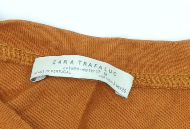 Close-up detail of Zara Trafaluc girls’ orange crew neck t-shirt s