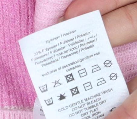 Brand and care label for Only Women's Pink Striped Knit jumper, size M