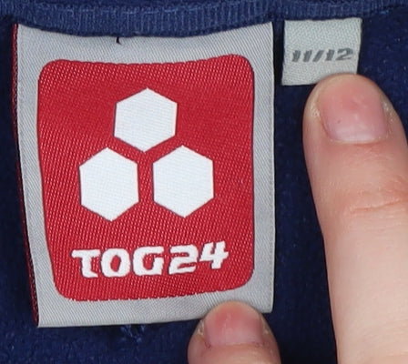 Brand and care label for TOG24 girls’ blue basic jacket 11 years mid-length