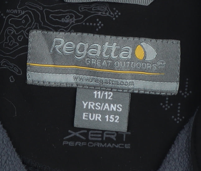 Brand and care label for Regatta boys’ black soft shell jacket 11-12 years