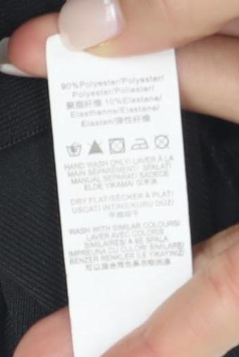 Brand and care label for Missguided Women's Black Bodycon Dress, size 6
