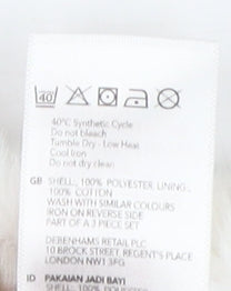 Brand and care label for Mandamay girls’' white waistcoat 3-6 months sleeveless casual