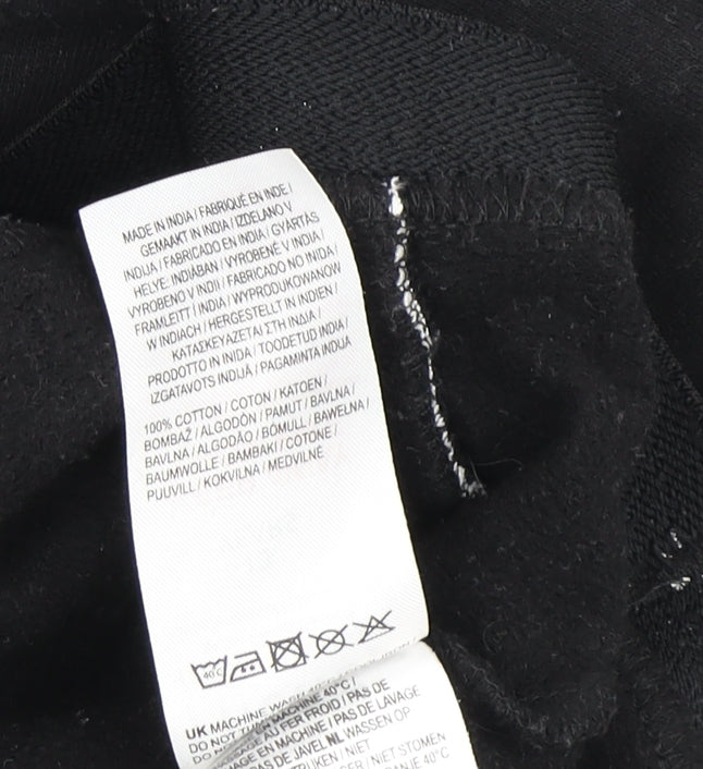 Brand and care label for Firetrap girls’ black hoodie, 13 years, 100% cotton, piping accents