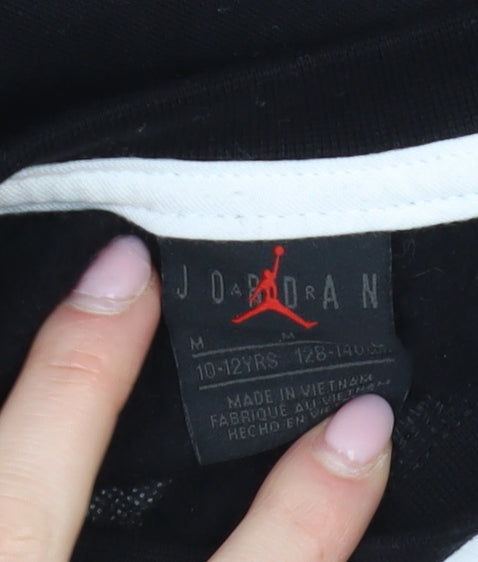 Close-up detail of Jordan girls’ black pullover sweatshirt m basketball logo