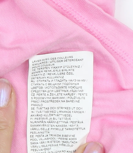 Brand and care label for PUMA girls’ pink t-shirt, 7-8 years, short sleeve, activewear
