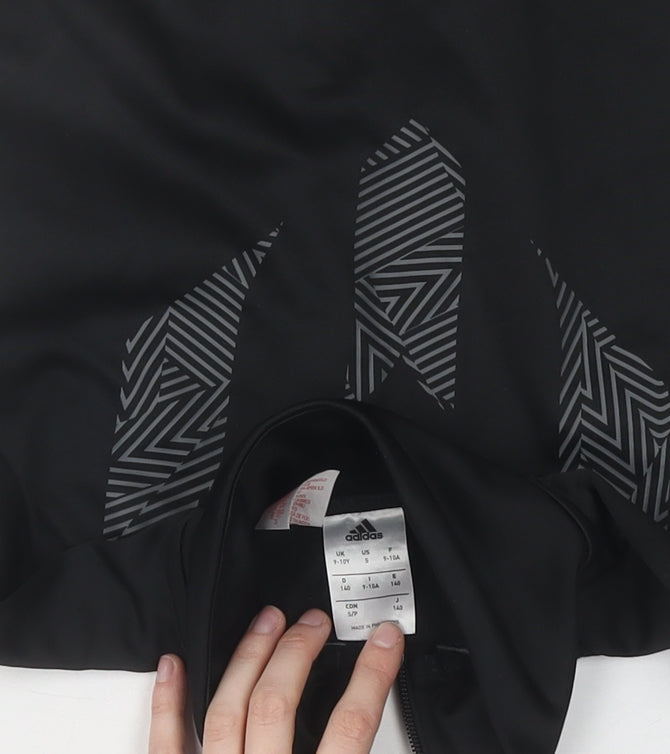 Brand and care label for adidas boys’ black track jacket, size 13, athletic fit