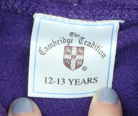 Brand and care label for The Cambridge Tradition Purple girls’ hoodie 12-13 years