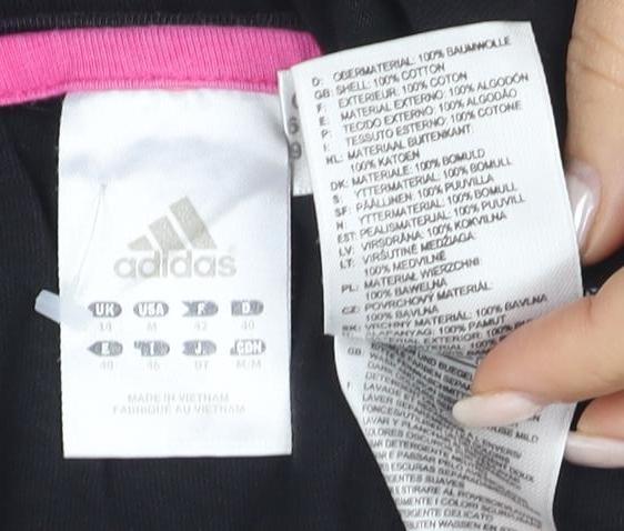 Close-up detail of Adidas Women's Black Short Sleeve T-Shirt, size 10