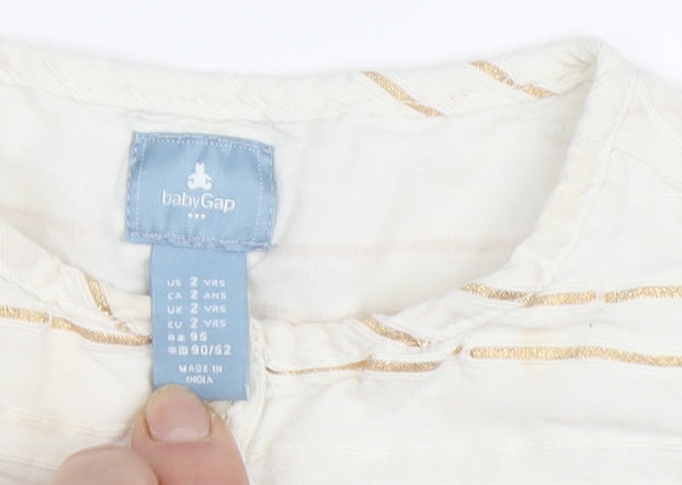Close-up detail of Baby Gap girls’ ivory striped blouse, 24 months, long sleeve