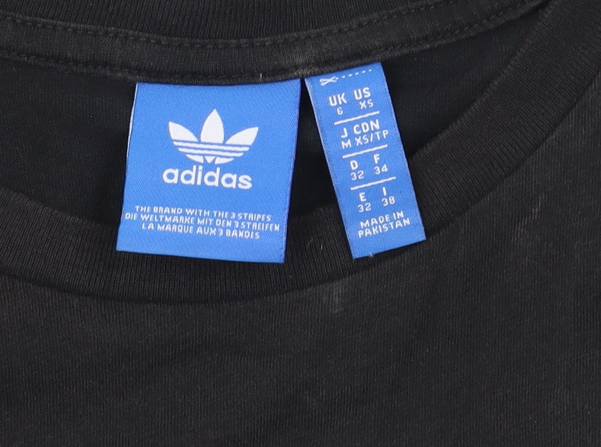 Brand and care label for Adidas Women's Black Cotton Tank Top XS