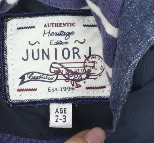Brand and care label for Junior J boys’' blue hooded puffer jacket 2-3y