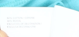 Brand and care label for GapKids girls’ blue embroidered blouse, size L, 10-11 years