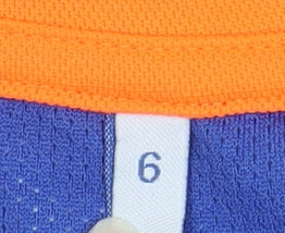 Brand and care label for Esquesei boys’ blue basketball jersey tank top, size 10, years