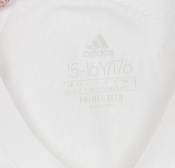 Brand and care label for Adidas boys’ white football jersey, size 16, athletic fit