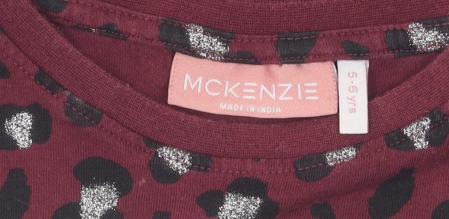 Brand and care label for McKenzie girls’ red cropped animal print t-shirt 5-6 years