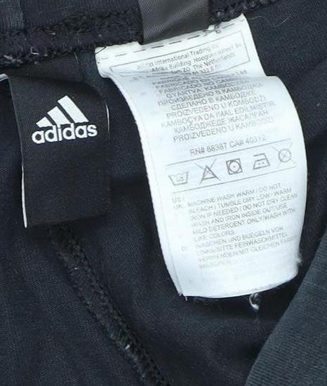 Brand and care label for Adidas girls’ black xs leggings for comfort & style