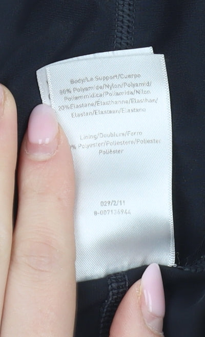 Brand and care label for Speedo girls’ black one piece swimsuit, size 14, years, lightweight
