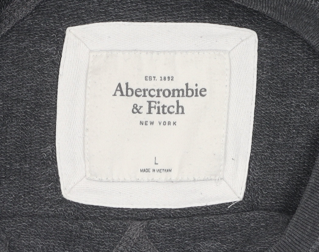 Brand and care label for Abercrombie & Fitch girls’ black sequin pullover sweatshirt, size L