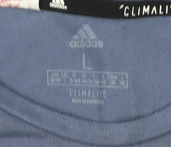 Close-up detail of Adidas boys’ blue graphic t-shirt, size L, active sportswear