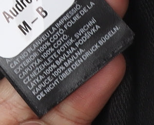 Brand and care label for H&M girls’ black hoodie, ciao graphic, 3-4 years