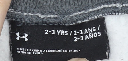 Brand and care label for Under Armour boys’ grey athletic shorts 2-3 years