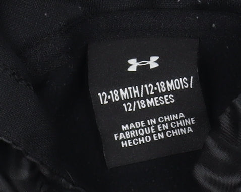 Brand and care label for Under Armour boys’ black pullover hoodie - 12-18 months