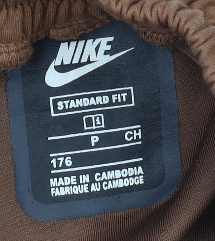 Close-up detail of Nike boys’ brown beige jogger trousers, size 176